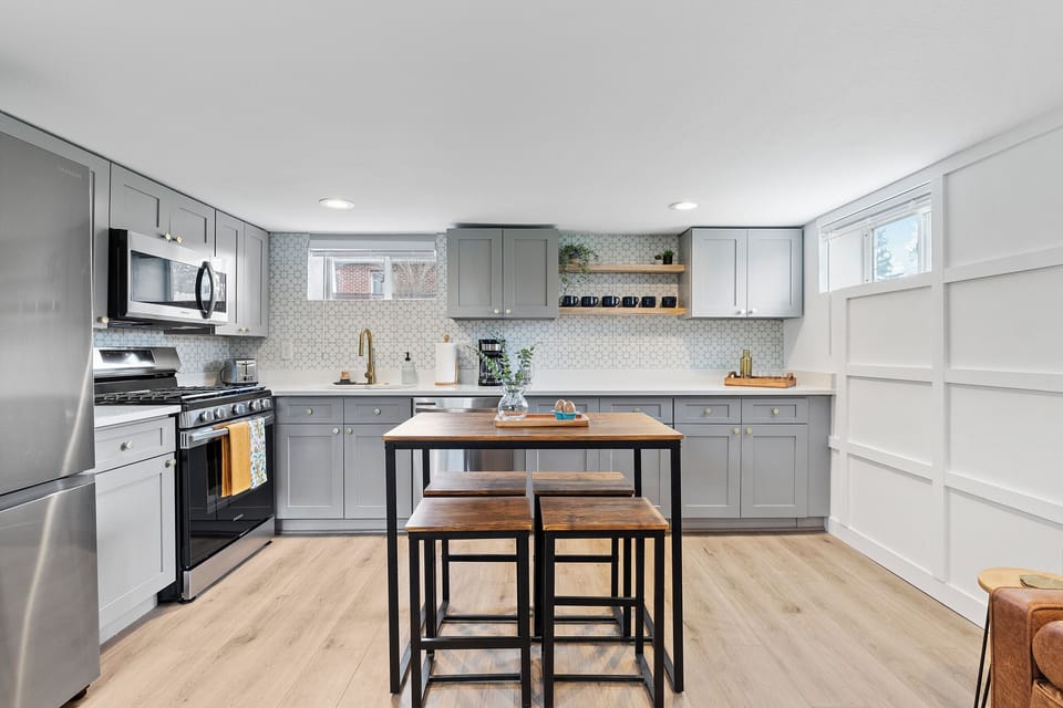 Bright, modern kitchen with full-sized appliances, and all the cookware you need