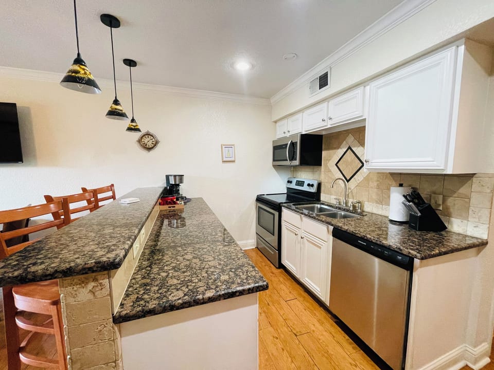 Gorgeous counters and full size appliances.