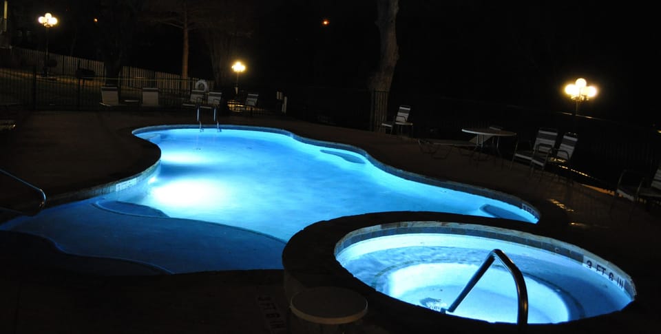 Pool is lit at night.