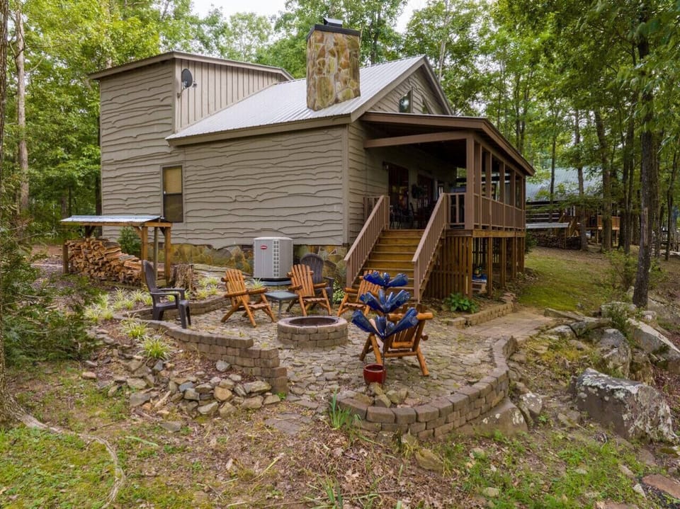 Fire Pit in the side yard of A Bear`s Lair. Wood Burning Fire Pit with Complimentary Firewood.