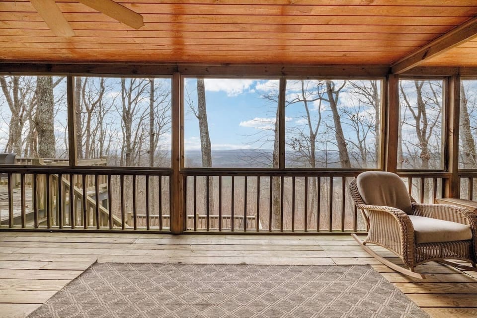 Enjoy stunning mountain views from the screened-in porch.