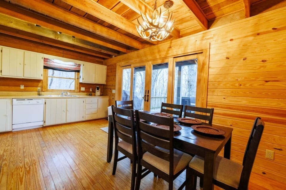 The kitchen includes a spacious dining table that comfortably seats six.