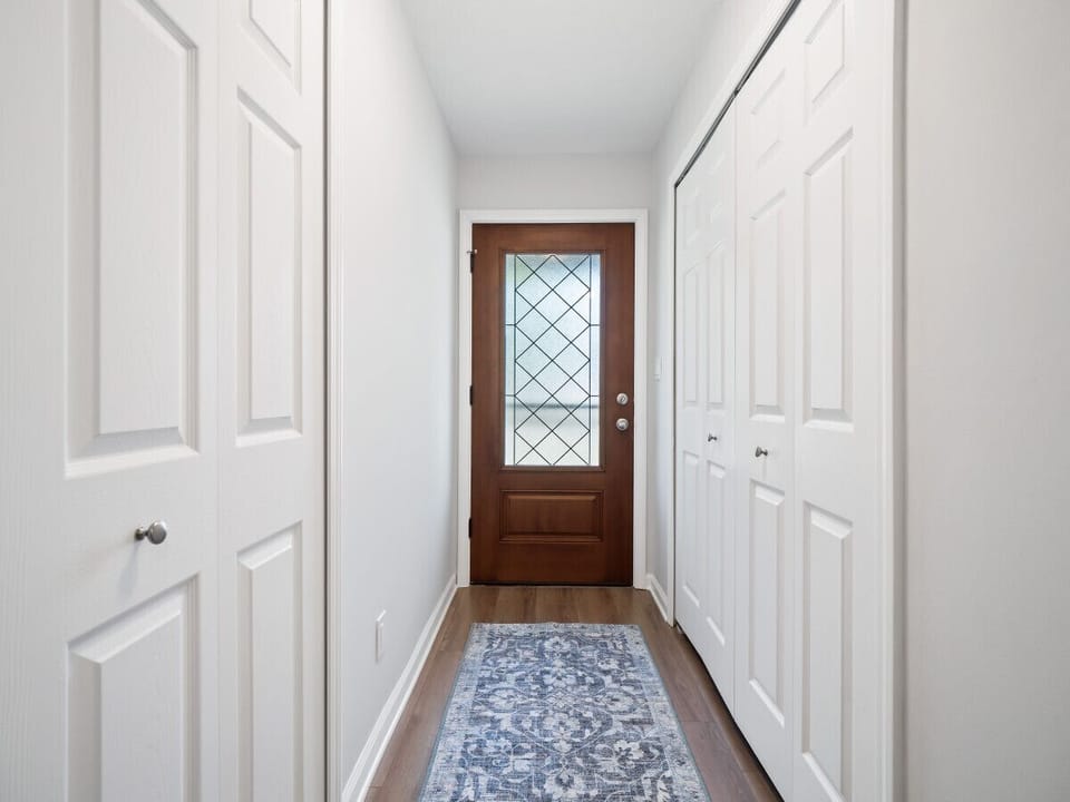Step through our bright and welcoming hallway, leading you to the heart of the home – an inviting open-concept living and kitchen area.