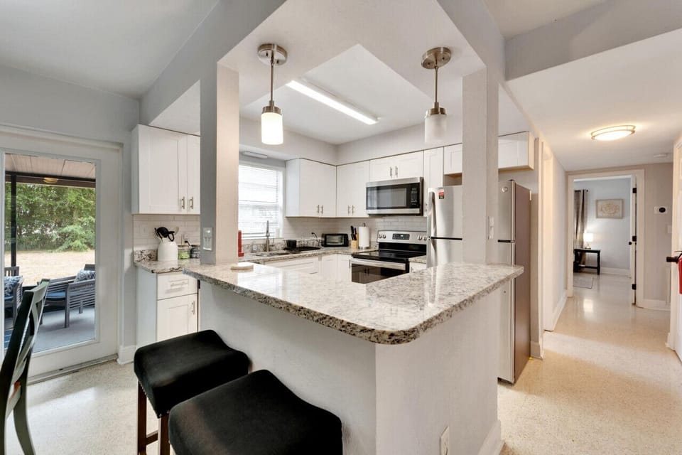 Fully stocked kitchen with all the essentials, complemented by bar seating for casual dining or socializing