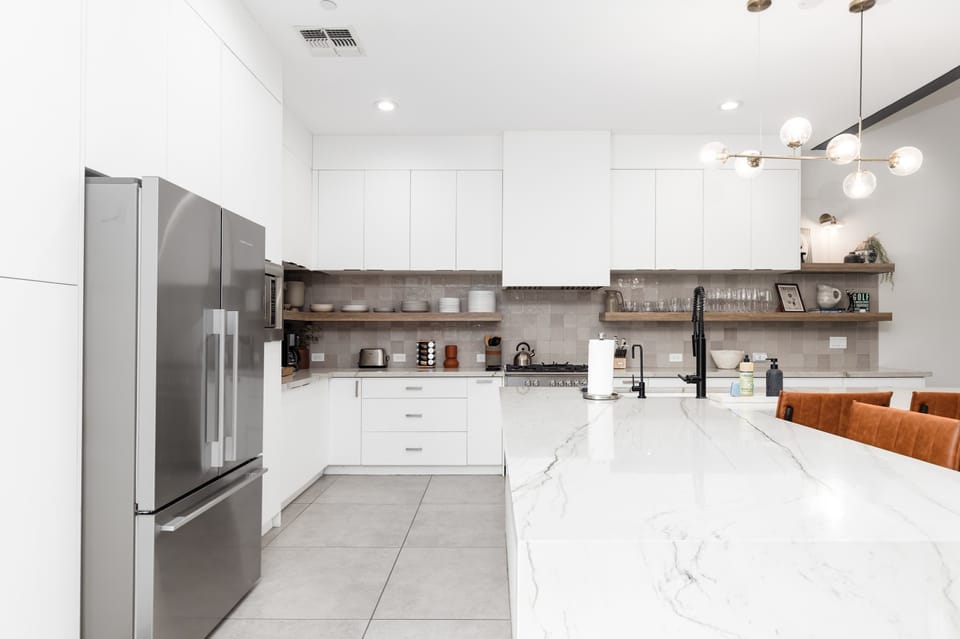 Full kitchen with fridge/freezer, large counter space