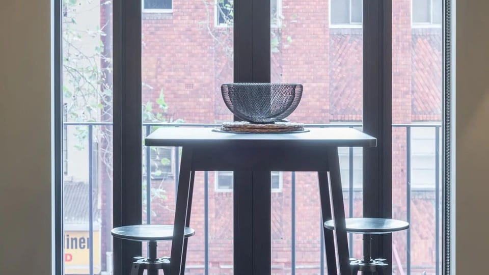 Step into elegance with French doors opening to city views.
