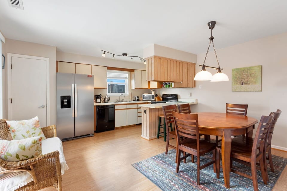 Whip up something delicious in the modern Kitchen to enjoy in the nearby dining area.