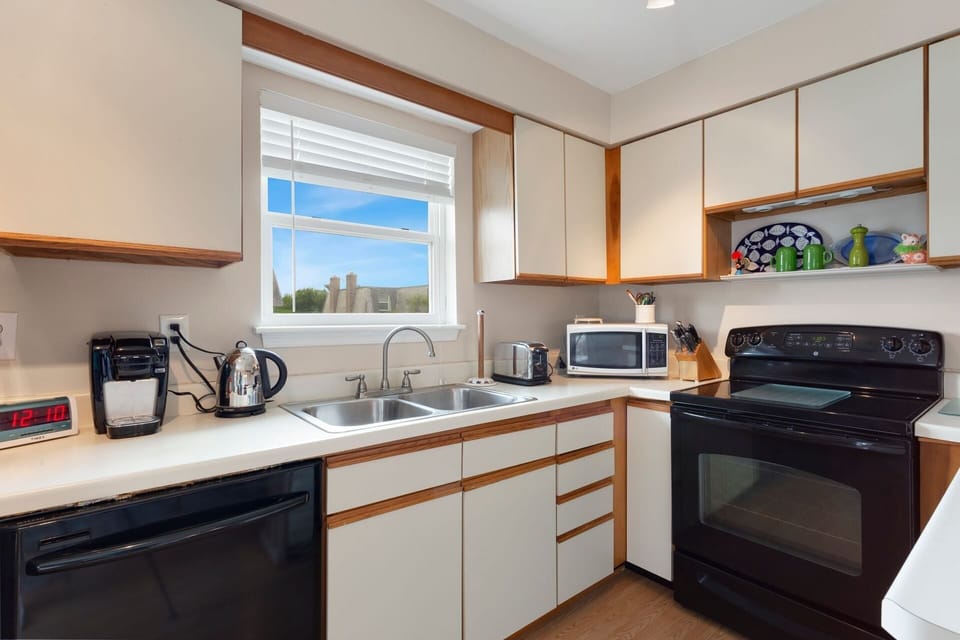 Whip up something delicious in the modern Kitchen to enjoy in the nearby dining area.