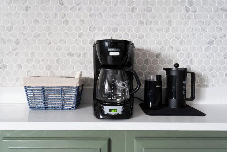 Coffee setup in main level kitchen. Drip, french press, grinder and essentials
