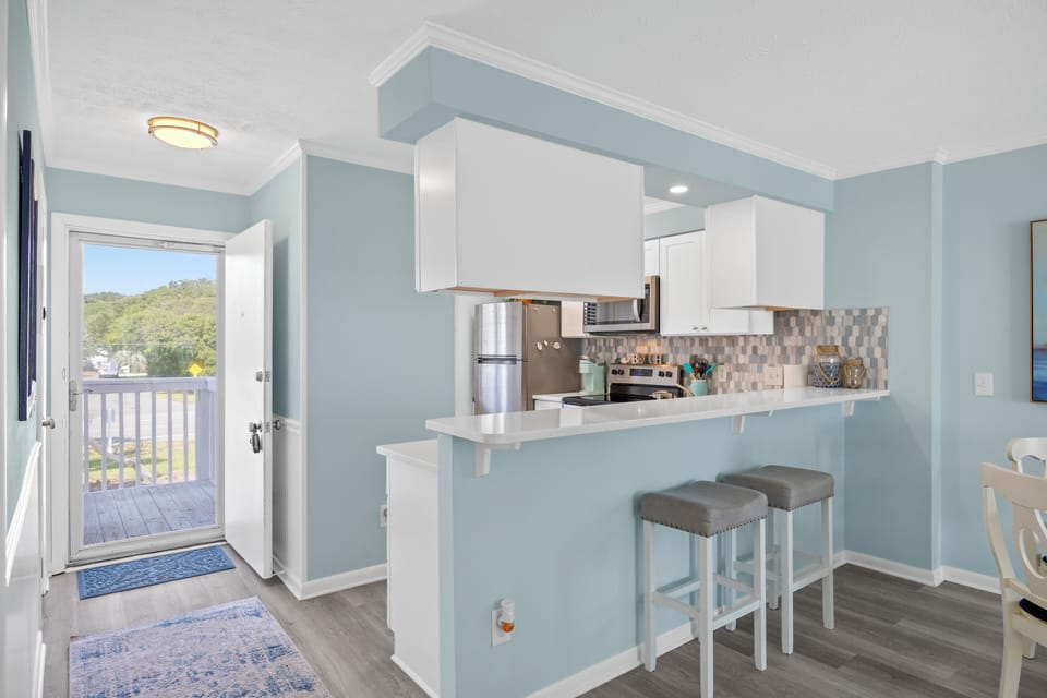 Front door entry way shows extra light, bar area. Indoor pool across the street