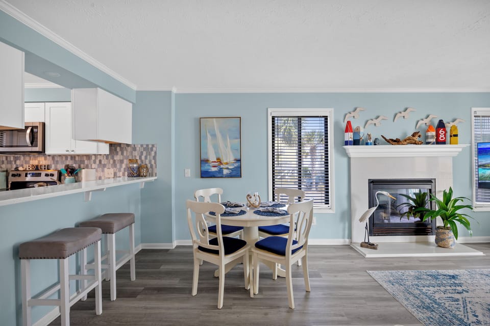 Dining area enough for 8 people. High end flooring displayed. Cal relaxing color