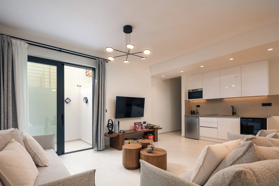 The lower floor playroom in the Left Building features a 65” TV, a PlayStation 5, and a well-equipped kitchenette. The additional four guests can sleep on sofa beds in the playroom.