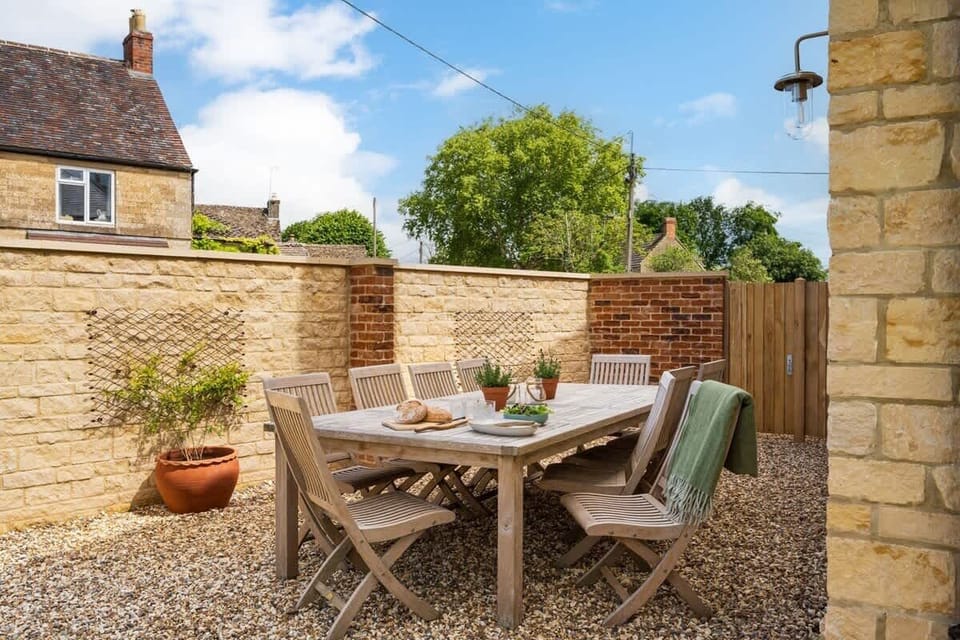 Seating and charcoal BBQ outside for warmer months