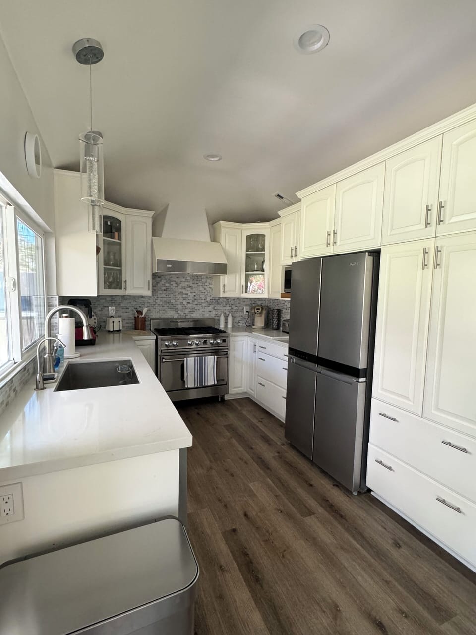 Fully equipped kitchen with stainless steel appliances and wine frig