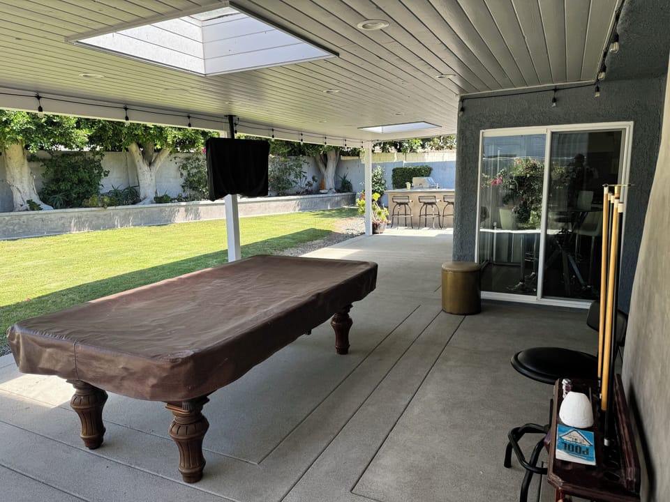 Backyard pool table with SmartTV and Sonos speakers