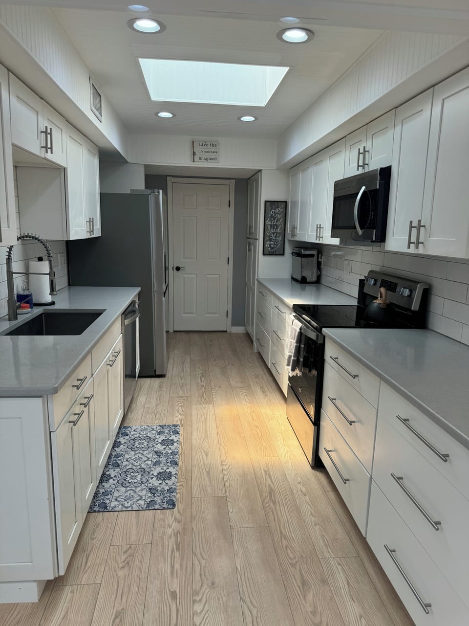 Kitchen with Laundry room off the back and entry into two car garage