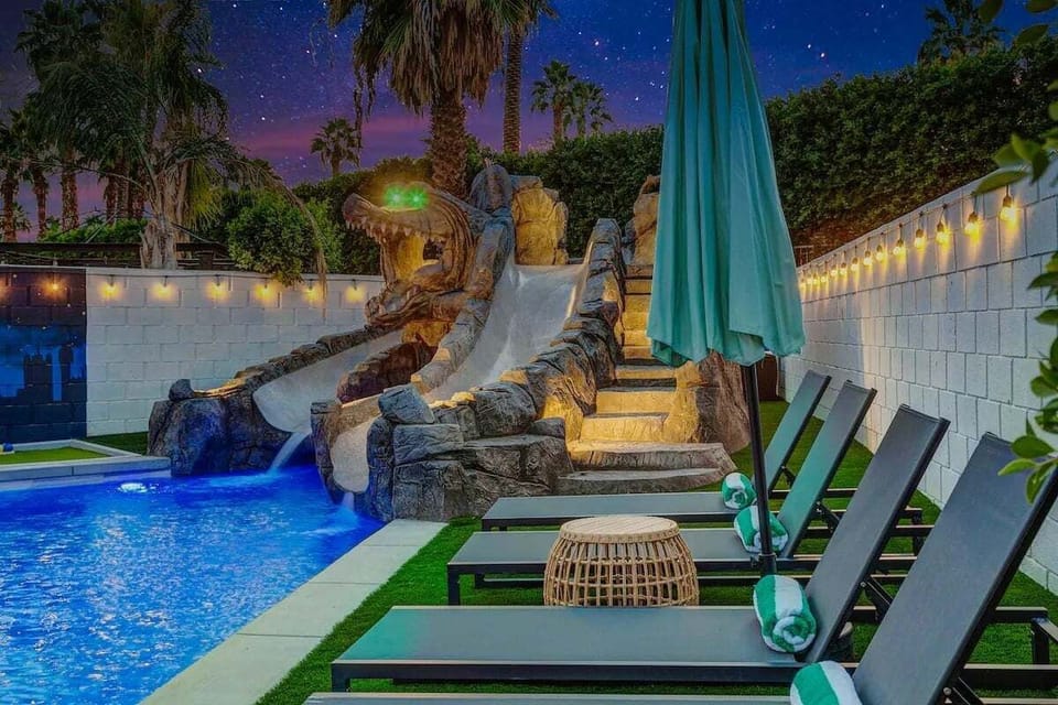 Lounge poolside with rolled towels and comfy chairs, or climb the steps and take the plunge for a nighttime thrill. It's the perfect blend of relaxation and fun, all under the desert stars.