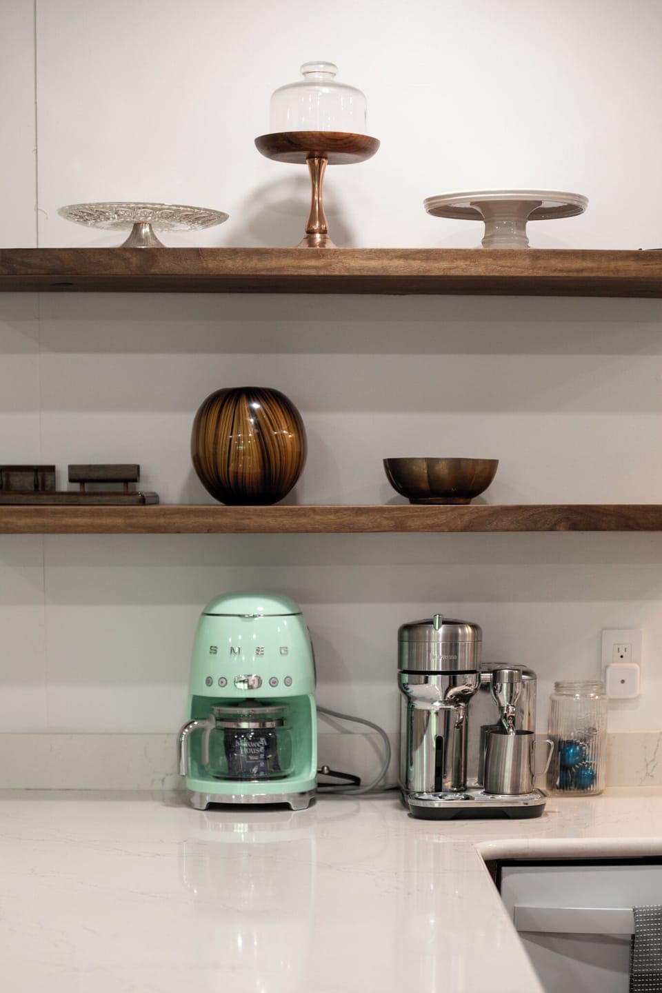Thoughtful coffee bar setup w/ SMEG drip machine & open shelving for your morning brew.