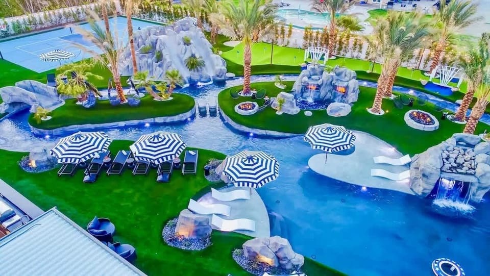 This vibrant daytime photo captures the heart of Lazy River Resort’s private water park.