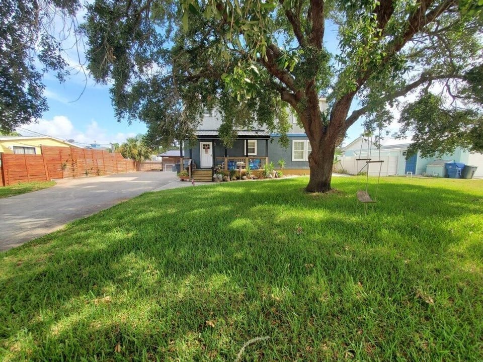Inviting vacation home with a spacious yard and ample parking.