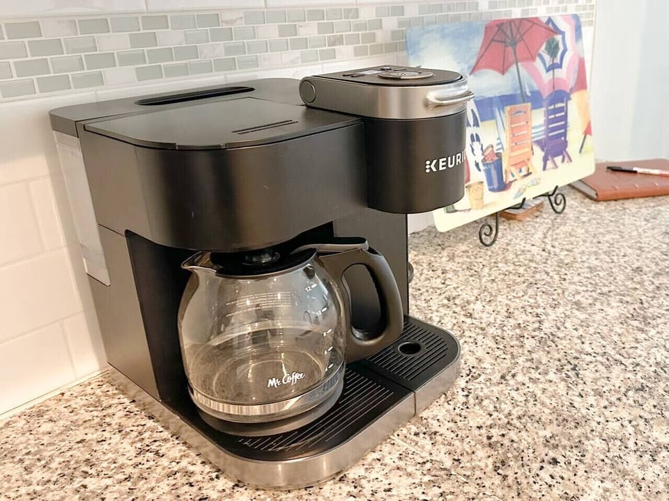 Start your day with a fresh cup of coffee using our versatile coffee maker, which offers both a Keurig single-serve option and a full pot for larger batches!