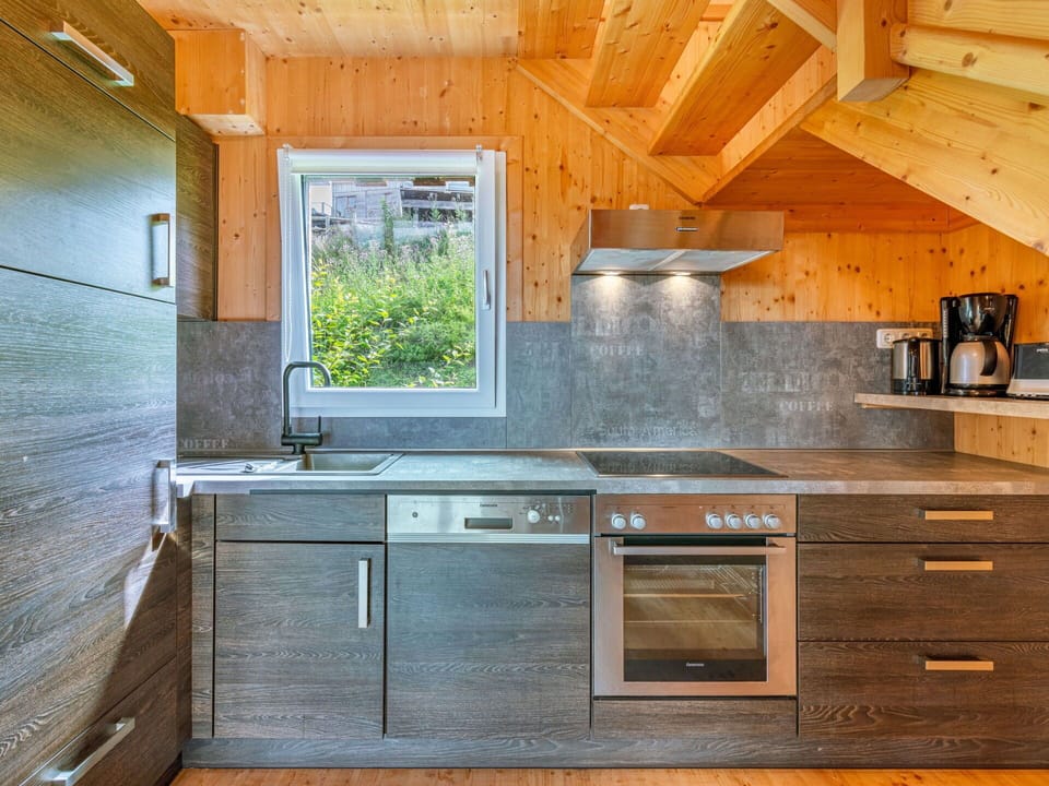 Cabinetry, Countertop, Property, Building, Kitchen Stove, Kitchen Appliance, Wood, Kitchen, Interior Design, Flooring