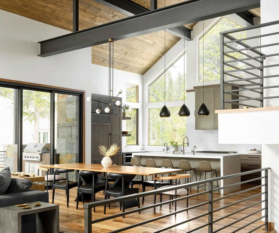 The dining area is situated between the living room and kitchen with a table with seating for 8.