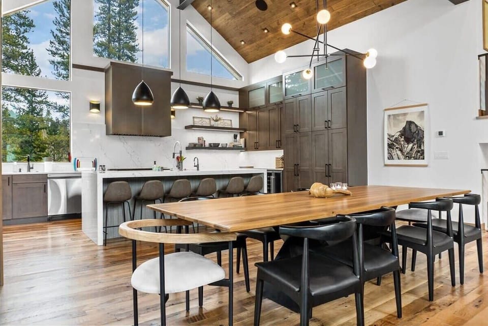 The dining table is situated next to the kitchen making it quick and easy to bring dishes to the table for a family-style meal.