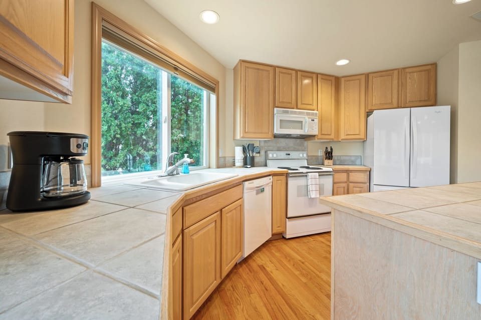 The kitchen is fully stocked w/plates, utensils, bakeware, cookware, glassware.