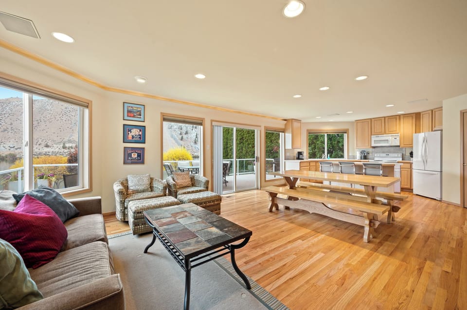 Main level living, dining, and kitchen. Deck access for outdoor entertaining.
