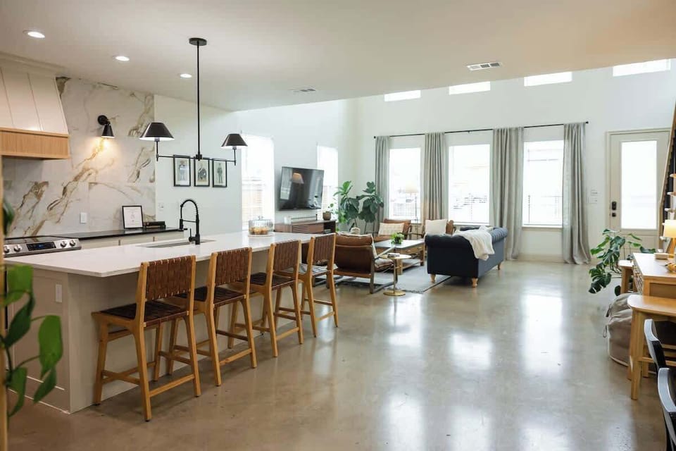 The Fitzgerald is an open concept floor plan downstairs. It is ideal for family time together. Wait until you see the outside gathering spaces as well