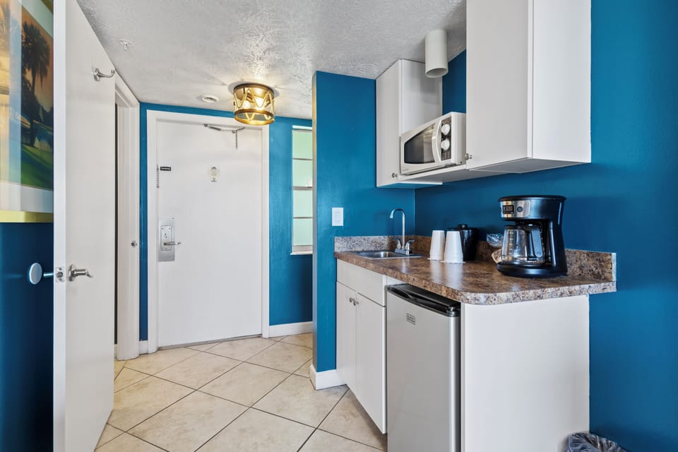 Amenities include a smart TV with cable, a mini fridge, a microwave, and a coffee maker.