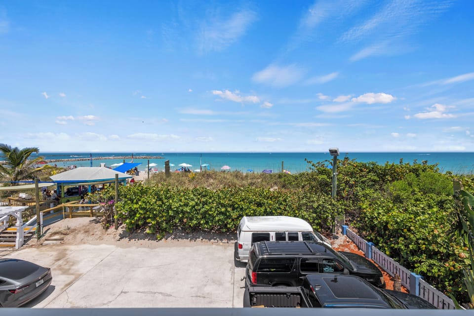 The view from the room overlooks the ocean, beach, and peaks of the Fort Pierce Inlet.