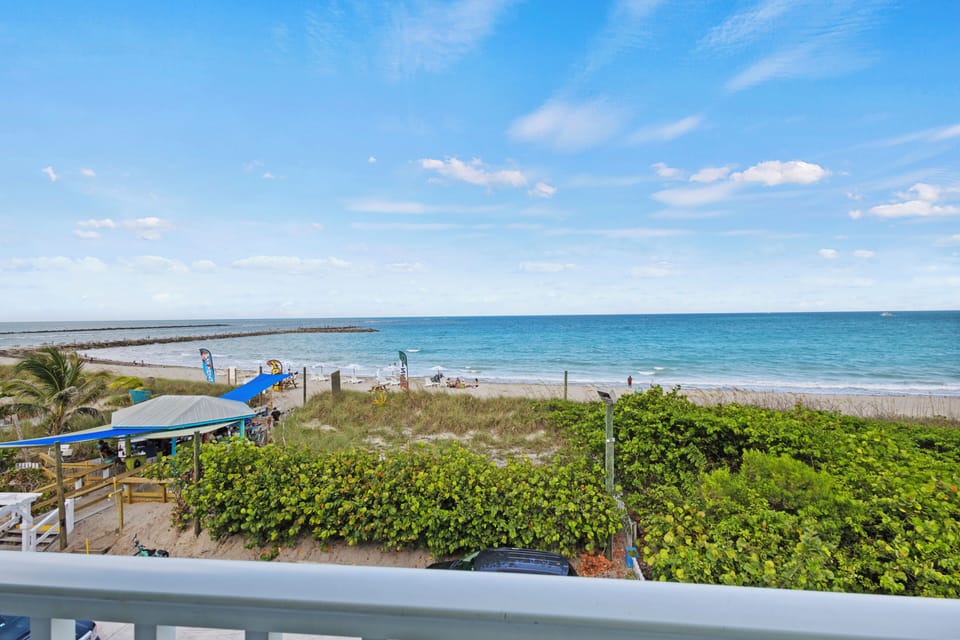 The view from the room overlooks the ocean, beach, and view of the Fort Pierce Inlet.