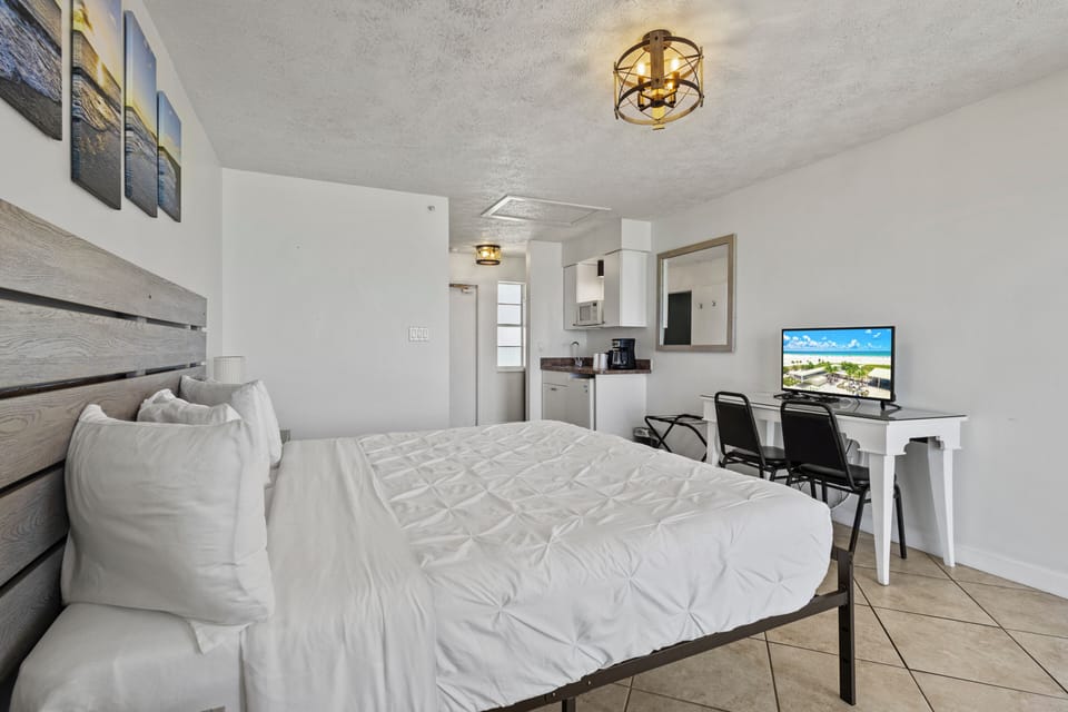Amenities include a smart TV with cable, a mini fridge, a microwave, and a coffee maker.