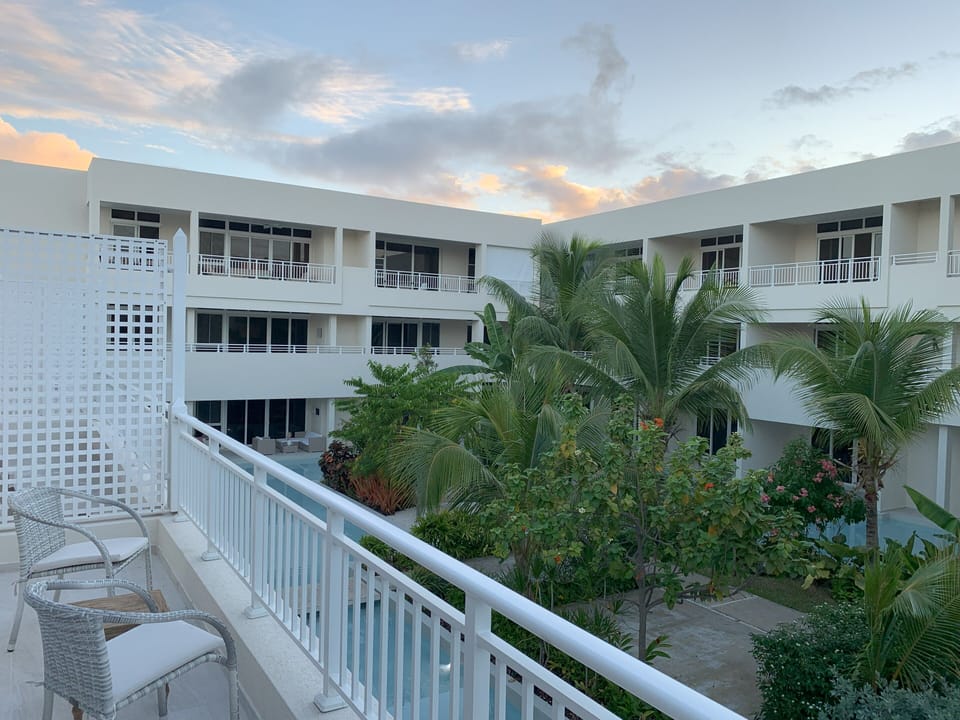 Greet the morning sun from the primary bedroom's balcony