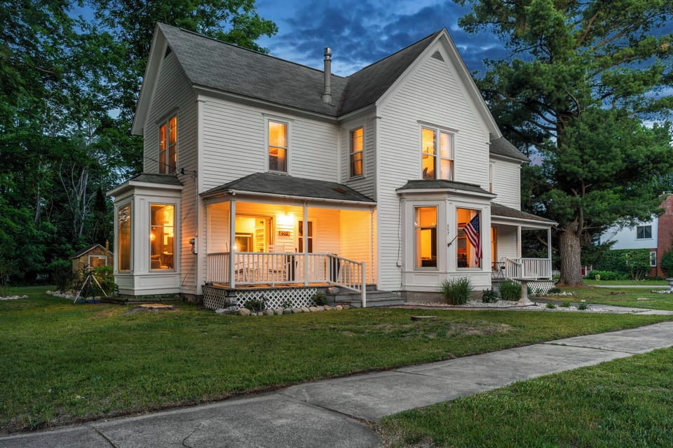 Front of House: Two (2) Porches w/ Rocking Chairs & Two-Person Bistro Set
