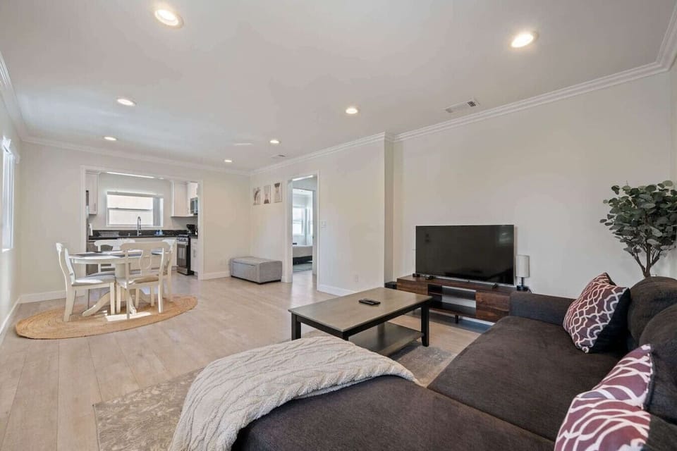 A modern TV setup in the living area, perfect for streaming your favorite shows, watching movies, or relaxing with some entertainment after a day of exploring. The space is designed for comfort and enjoyment for all guests.