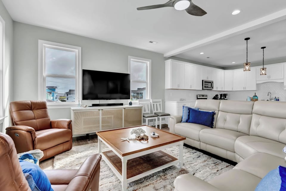 Gather in the cozy living room, featuring plenty of comfortable seating for everyone!