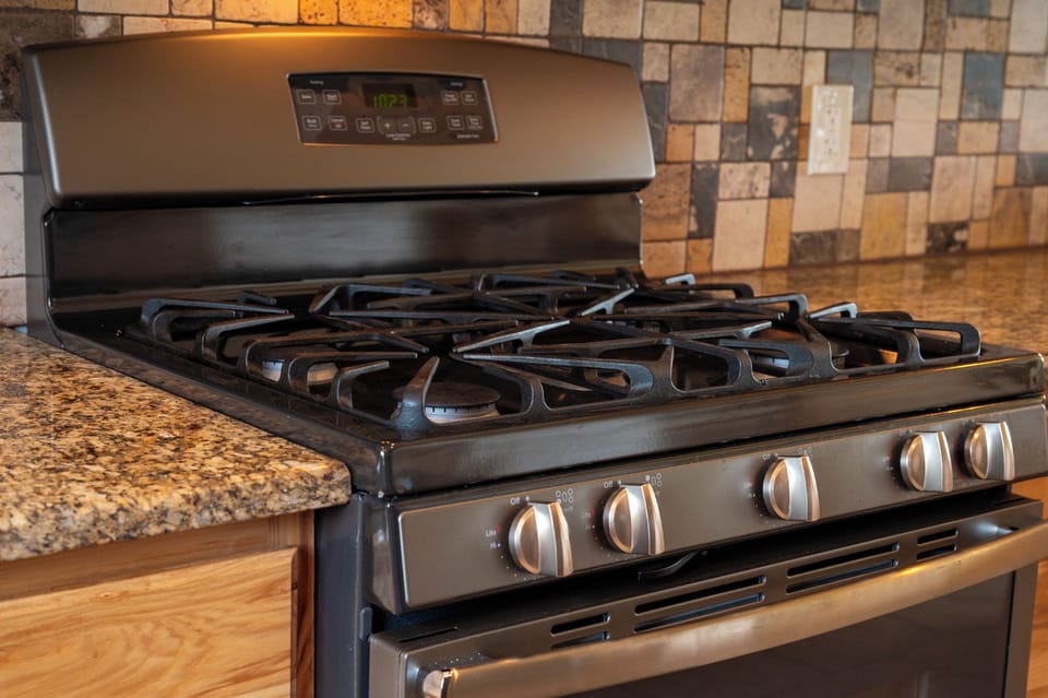 - Modern gas stove with granite counters and backsplash   - Fully equipped kitchen for cooking family meals   - Perfect setup for cozy nights in the mountain cabin