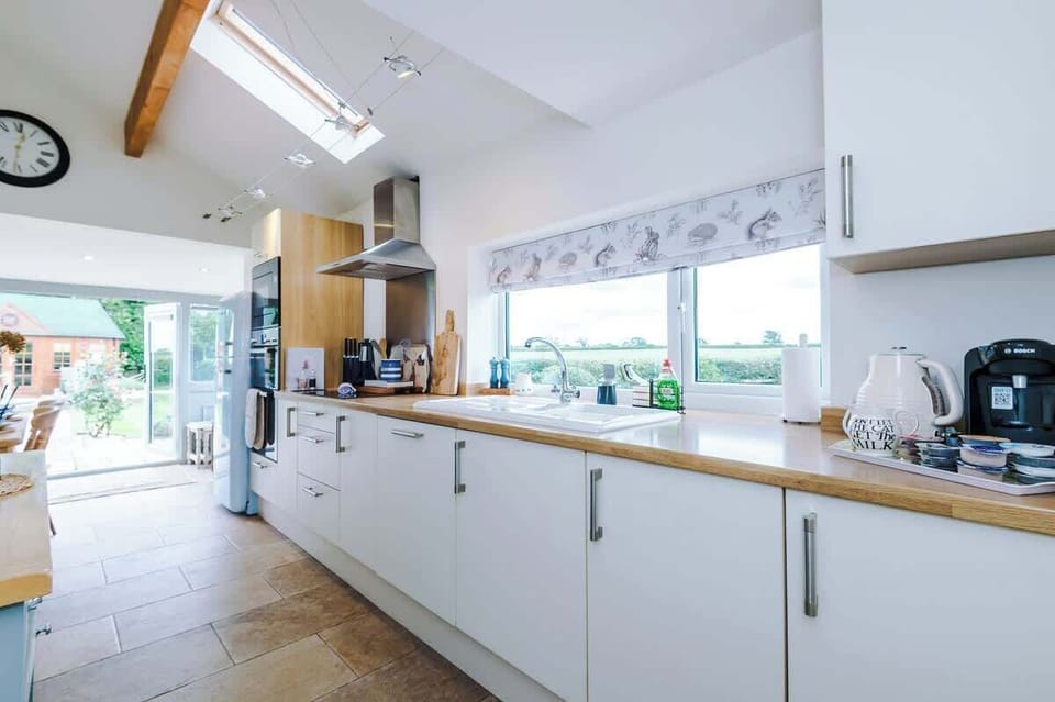 The large kitchen is fully equipped with everything you need for your long or short stay with us. There is an electric hob, double oven, fridge freezer, dishwasher, Coffee machine, microwave, toaster, kettle, washing machine & dryer. 