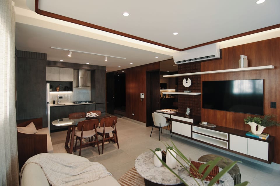 Open-concept space, integrating a modern kitchen and smart TV