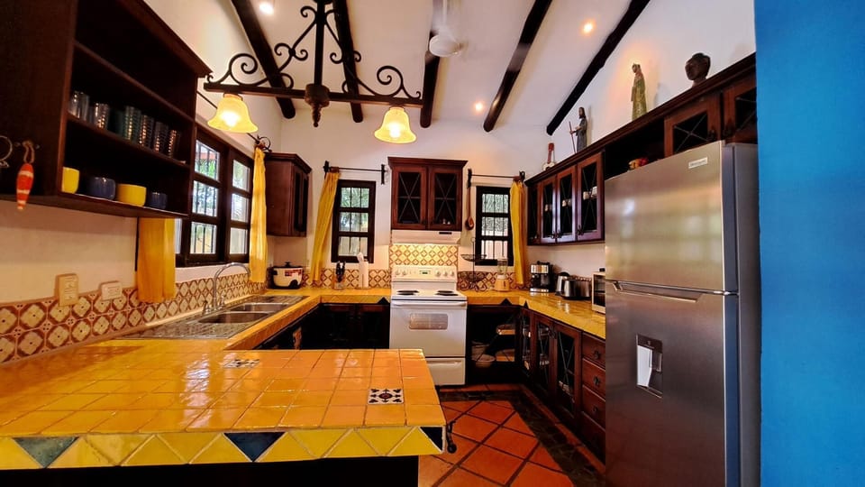 Full kitchen with Mexican tile counter tops.