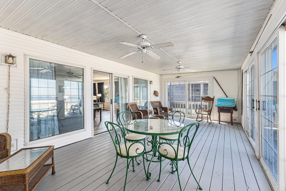 Enjoy an enclosed porch with sliders off the main living area.