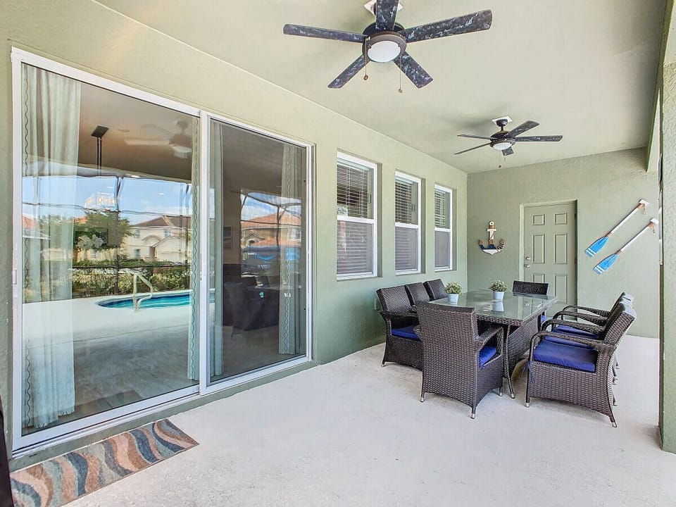Poolside table and chairs—relax, dine, unwind.