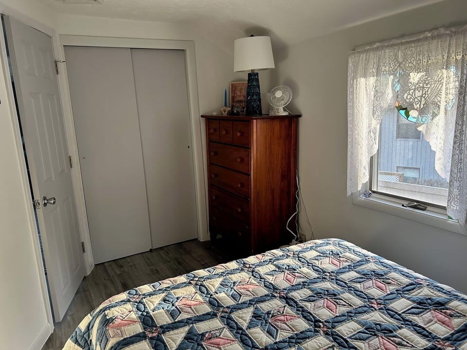 Upstairs bedroom.  Full size bed. Dresser. Closet, w/hangers & shelves.