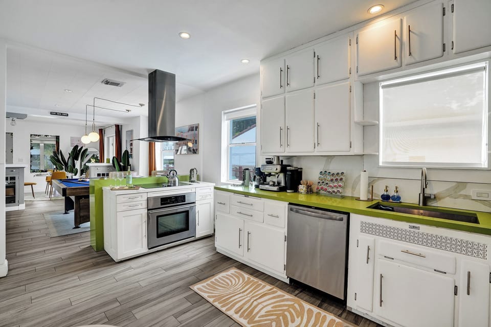 Ample cupboard spaces and hardwood floors for the kitchen