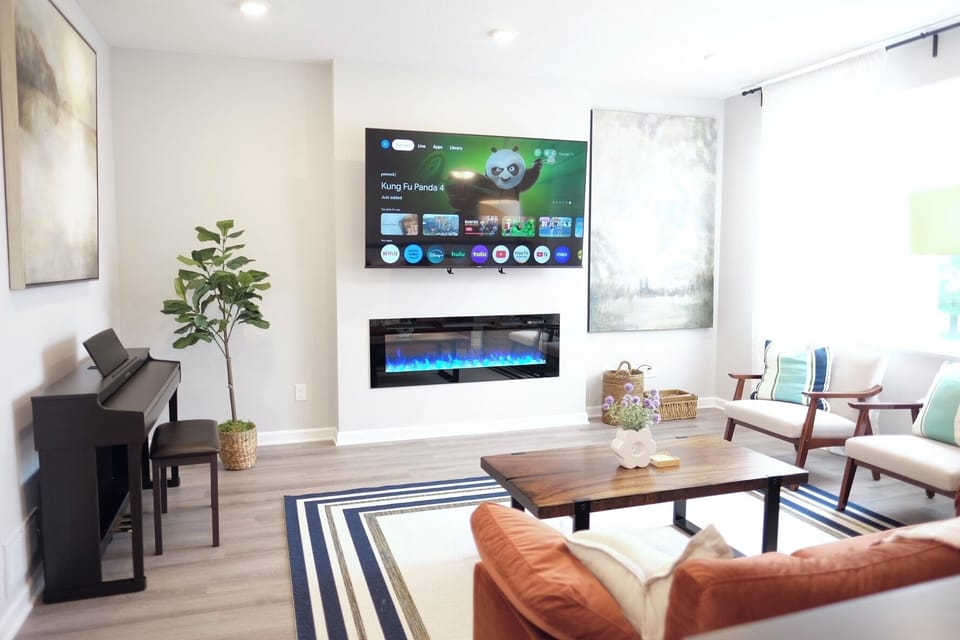 Beautiful decorated living room with 75inch TV that is mounted on mantel mount