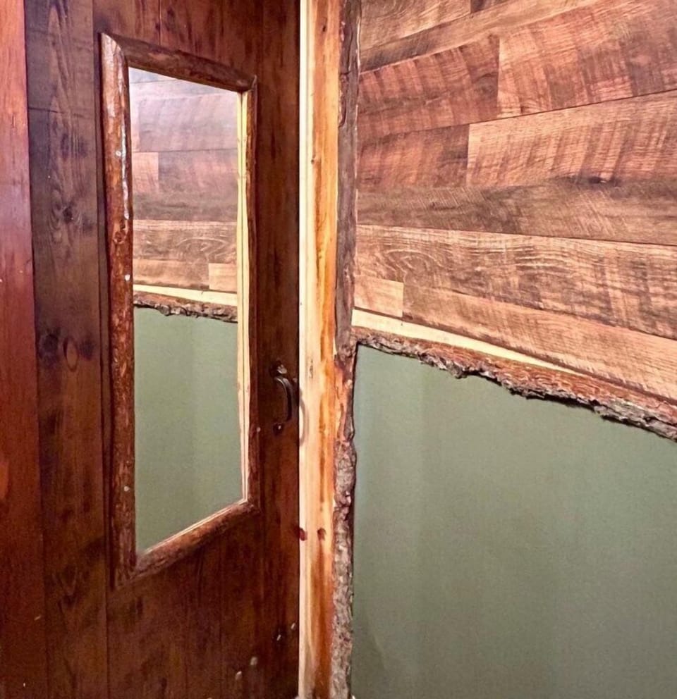 Looking at the bathroom door, you may notice all of the original touches to make this stay unique and memorable. 