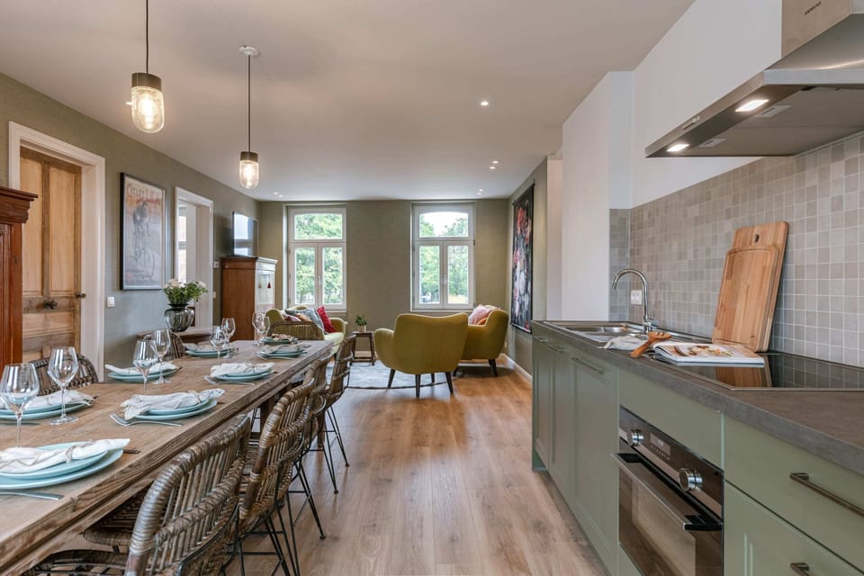 Dining room with open kitchen; perfect for enjoying moments with friends and family
